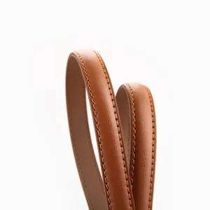 Slim brown leather belt for women, elegant minimalist strap with contrast stitching for dresses.