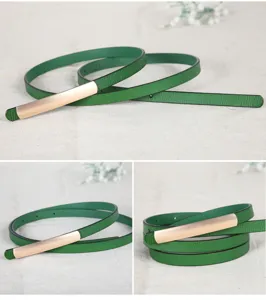 Green thin leather belt detail, elegant metal buckle accessory for women dresses.