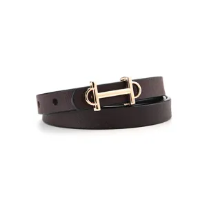 Women's brown leather belt with elegant gold metal buckle stylish minimalist waist accessory.