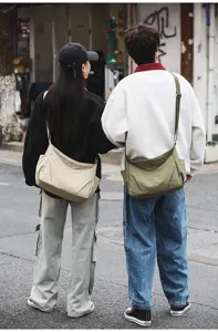 Casual nylon crossbody bag, large capacity messenger bag with side pockets for daily use.