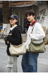 Detail view of large capacity nylon shoulder crossbody bag for daily use, casual and student travel.