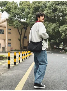 Casual nylon crossbody bag for daily use, lightweight messenger bag with spacious main pocket.