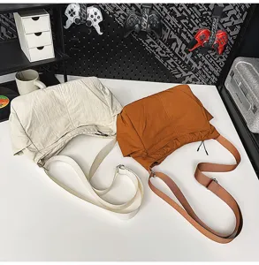 Casual nylon shoulder bag detail view, showing large capacity and durable crossbody strap design.