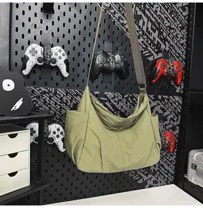 Large capacity nylon crossbody bag for women, lightweight casual shoulder tote bag with multiple pockets.