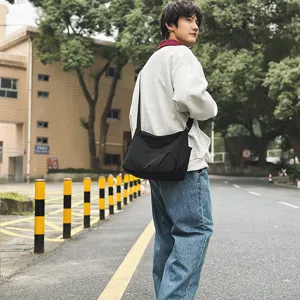Casual black nylon crossbody shoulder bag with large capacity and lightweight student design.