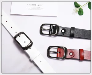 Detailed view of women's leather belt featuring a sleek metal buckle and classic design.