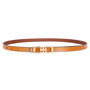 Close-up detail of a slim brown leather belt featuring a sleek golden metal buckle design.