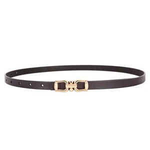 Detail view of women thin leather dress belt with elegant gold metal buckle stylish accessory