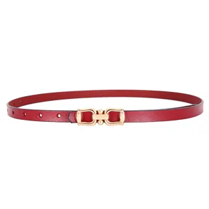 Details of the red leather belt featuring a chic gold metal buckle for women's stylish wear.