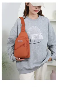 Stylish casual orange chest bag for women, versatile outdoor nylon crossbody daypack.