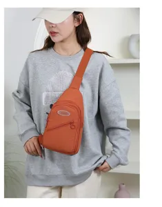 Orange casual sling bag for women, multi-pocket crossbody chest bag for daily use.