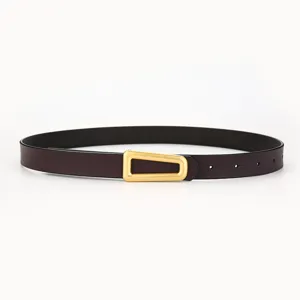 Minimalist women leather belt featuring a distinctive gold tone triangle buckle accessory.