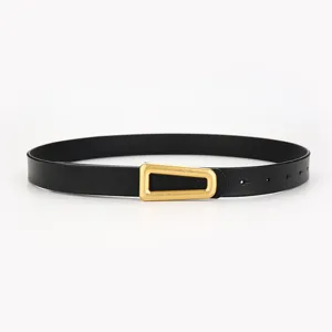 Minimalist women's black leather belt with a unique gold geometric buckle for versatile daily wear.