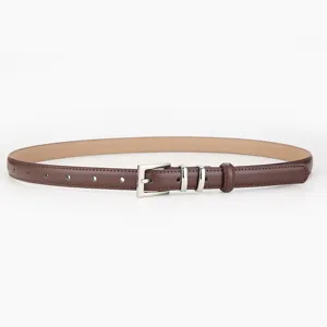 Details of the dark brown leather belt with silver pin buckle, featuring fine stitching and loops.