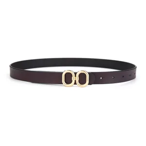 Detailed view of women's minimalist brown leather belt with elegant gold double-ring buckle.
