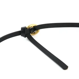 Minimalist black leather belt for women with gold buckle, stylish adjustable waist accessory.