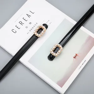 Women thin black leather belt with elegant pearl rhinestone buckle for chic dresses and outfits.