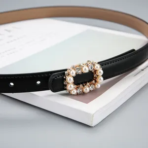 Elegant black women leather dress belt featuring a stunning pearl rhinestone buckle.