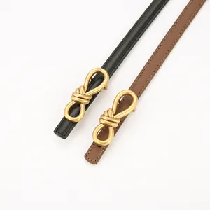 Women genuine leather thin belt with elegant metal knot buckle, stylish waist accessory.