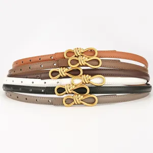 Women thin leather belt with stylish metal bow buckle, versatile waist cincher for dress.