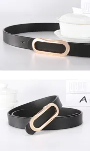 Close-up detail of the womens black leather belt featuring a sleek gold-tone oval metal buckle.