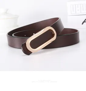 Women's slim brown leather belt with gold oval buckle, chic minimalist pants accessory.