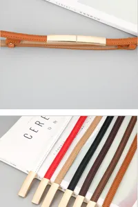 Detailed view of thin leather belts with metal magnetic buckles, multiple colors available.