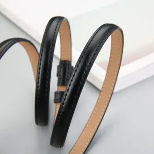 Minimalist black thin leather belt for women, elegant narrow waist strap for dress and suit.