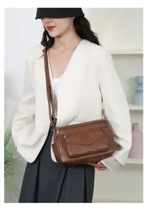 Brown leather shoulder bag with multi pockets and braided detail for women detail view
