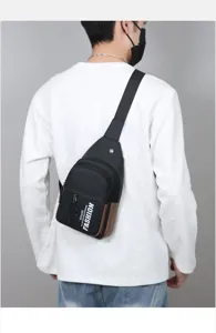 Men's casual chest bag, stylish black cross body bag with zipper pockets and straps.