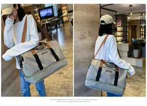 Large capacity travel duffel bag with bottom compartment for gym sports and short trips outdoor.