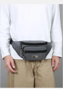 Close-up of men grey multi-pocket waist bag worn by model, outdoor casual style