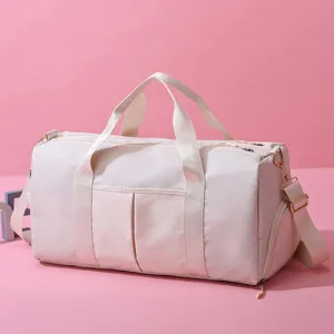 Detail view of large capacity travel duffel bag with side pocket and shoulder strap.