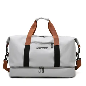 Large capacity travel duffel bag for gym, sports, and short trips with bottom compartment.