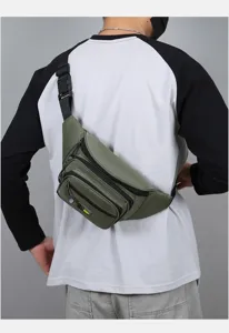 Detail view of men's tactical chest bag, green multi-pocket utility crossbody bag.