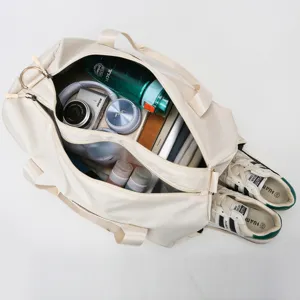Large capacity travel duffel bag with organized compartments for fitness, yoga, and outdoor trips.