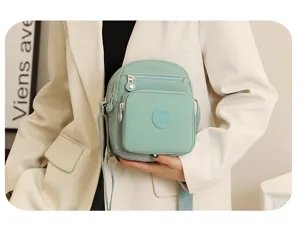 Sac bandoulière décontracté en nylon vert clair multi-poches pour femme voyage quotidien.