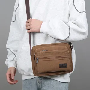 Men's casual canvas crossbody bag with multi-compartments, stylish shoulder bag for daily commute.