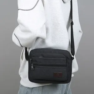 Men casual canvas messenger bag multi-compartment shoulder cross body bag main product view.