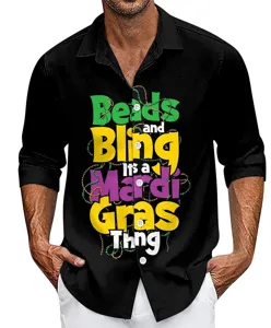 Detailed view of men's black long sleeve shirt with colorful Mardi Gras festival print.