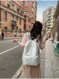 Light blue star pattern backpack for women, cute school book bag for teen girls and travel.