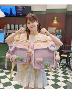 Detailed view of the cute Japanese ins style clear ita backpack with sweet plush charms.