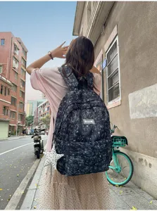 Dark star printed canvas backpack for women, cute school bag with star pendant, casual daypack.