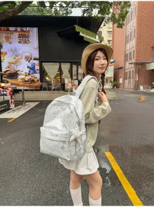 Star print casual school backpack for women and girls, stylish travel daypack for daily use.