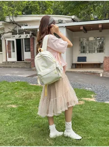 Casual tie-dye school backpack for women, cute aesthetic student travel daypack with pockets.