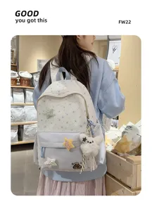 Star embroidered canvas backpack with cute plush charms, ideal for school and daily travel.