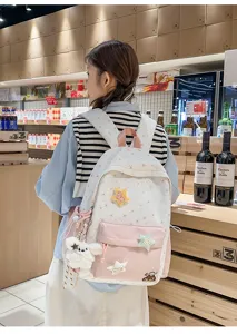 Sweet star embroidery canvas backpack with cute bear pendant, perfect for daily casual travel.
