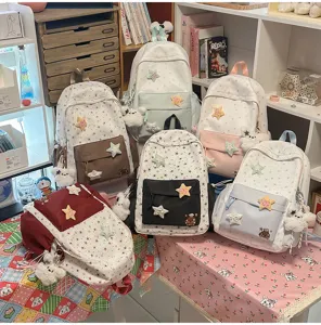 Cute star embroidered canvas backpack with plush bear pendant, sweet style casual travel bag.