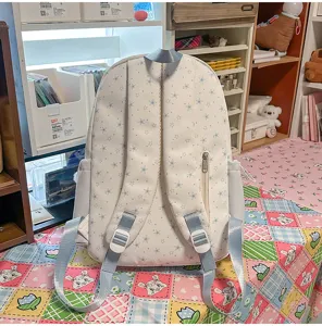 Detailed view of the sweet blue star embroidered backpack, showcasing cute lifestyle room setting.