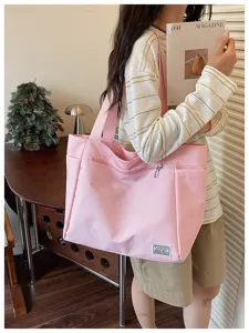 Sac cabas rose en toile texturée, sac d'épaule décontracté pour le travail quotidien.